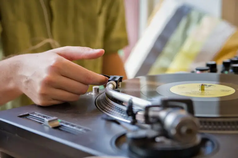 Someone playing music on a vinyl record